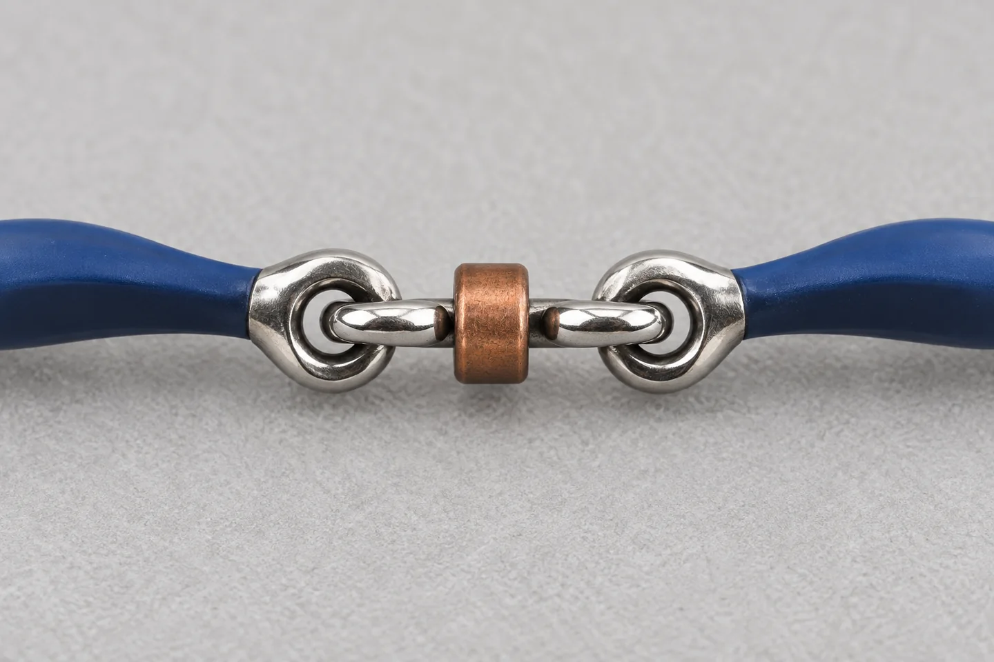 Close view of a blue mouthpiece with articulated center link and copper-colored roller