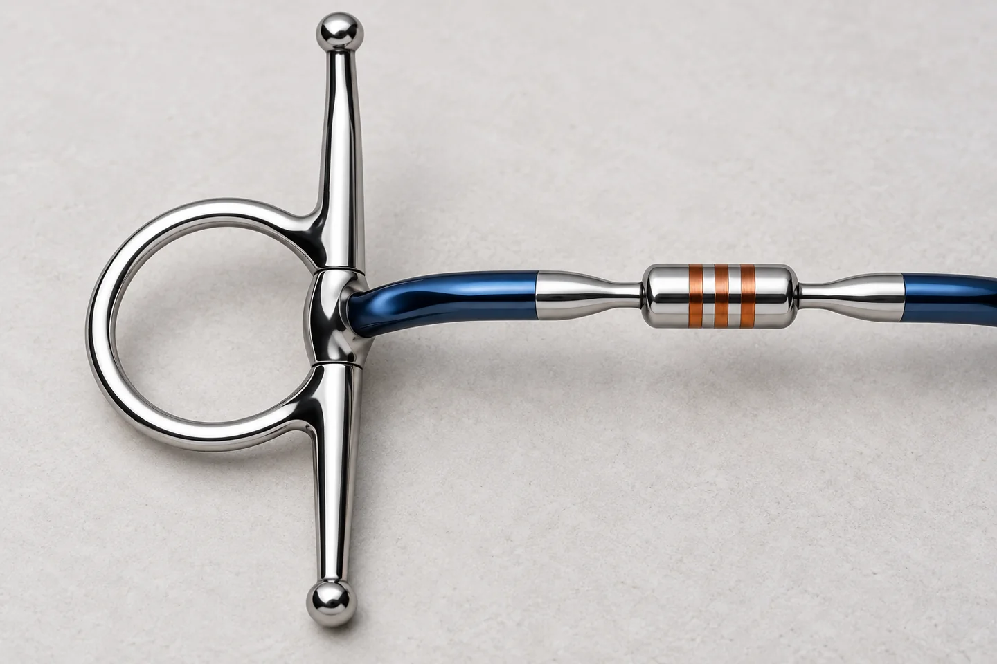 Close view of a horse bit mouthpiece connection, ring and full cheek
