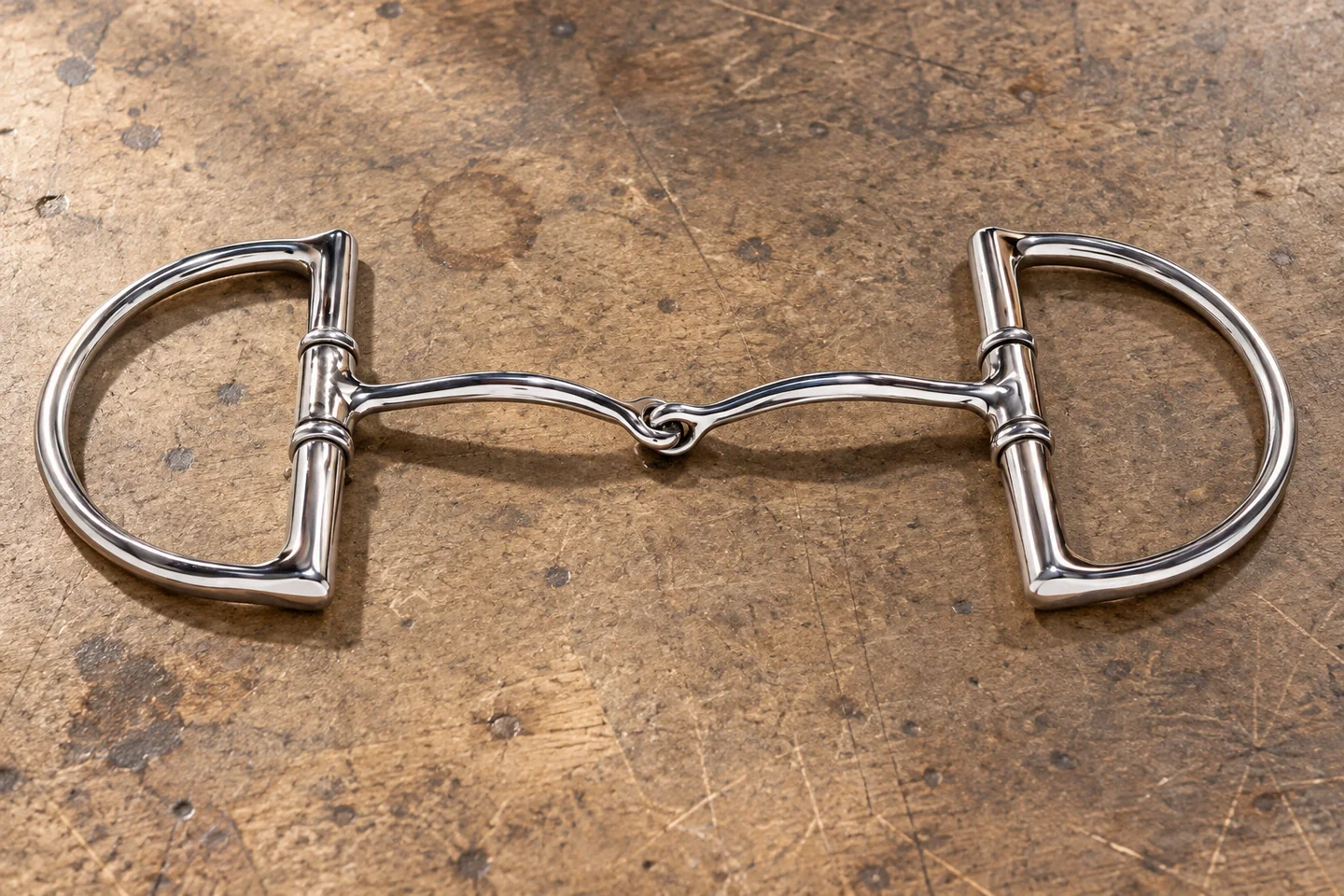 Polished D-ring horse bit with a single central joint