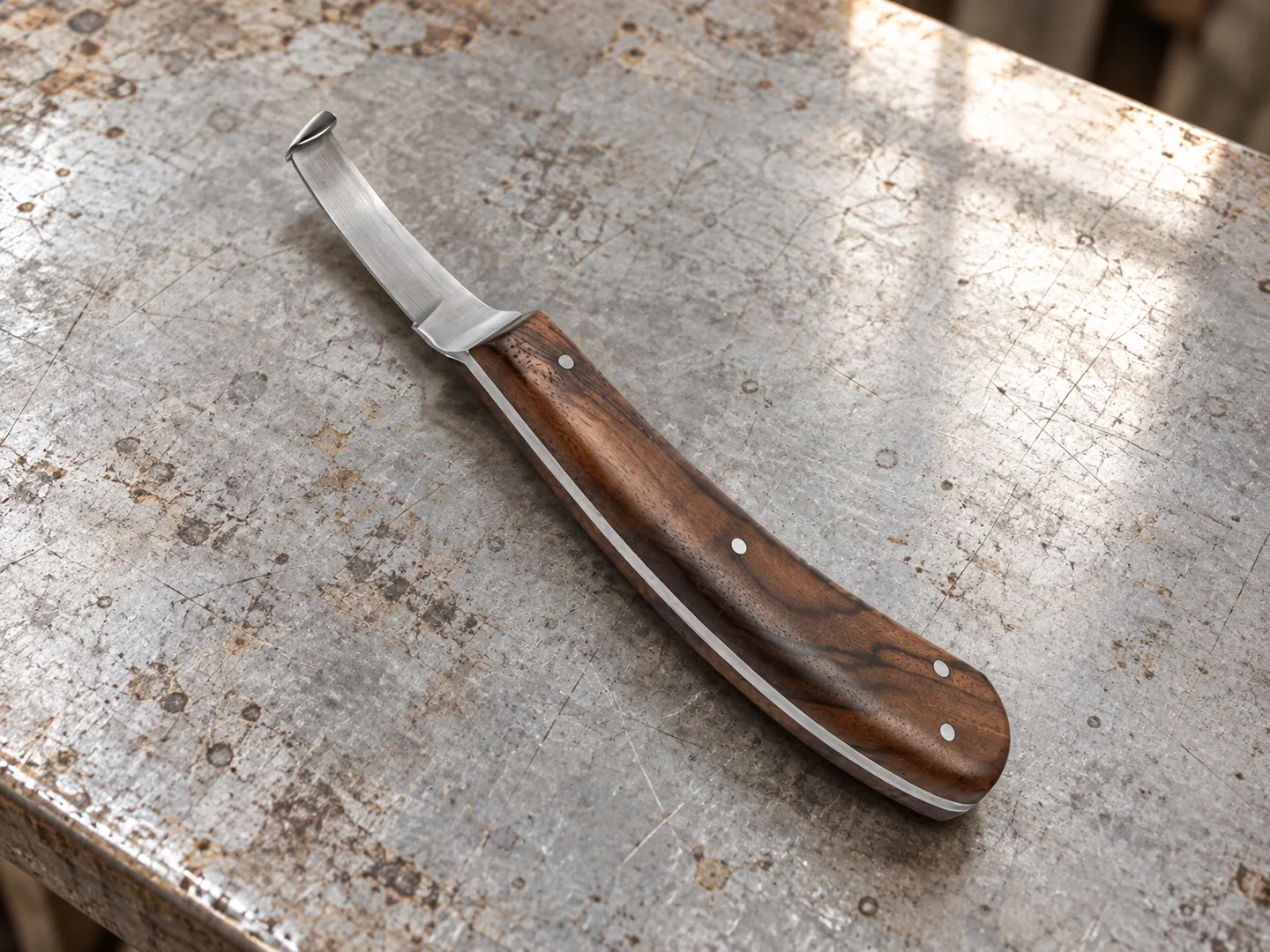 Hooked hoof knife showing its riveted wooden handle and curved blade